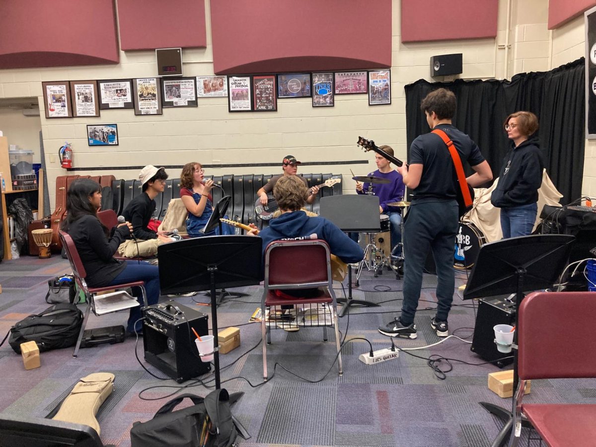 Practicing after school, Tuesday Night Rock Band prepares for their performance for the Acoustic Variety Show. Tuesday Night Rock Band is the host of the event and will be performing on Nov. 9.