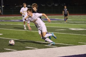 Riding the sideline, junior Andrew Dillard sprints past his Fort Zumwalt West defender. The Lancers trailed 3-1 at halftime, however, they came back to win 4-3 in overtime, with Dillard scoring the equalizer. 