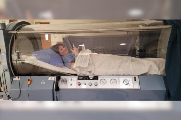 To treat sepsis from his partial top surgery, Class of 2023 graduate, Mateo LaMar receives hyperbaric oxygen therapy. LaMar has been left with permanent scarring from the procedure, but says he does not regret it. Photo courtesy of Mateo LaMar.