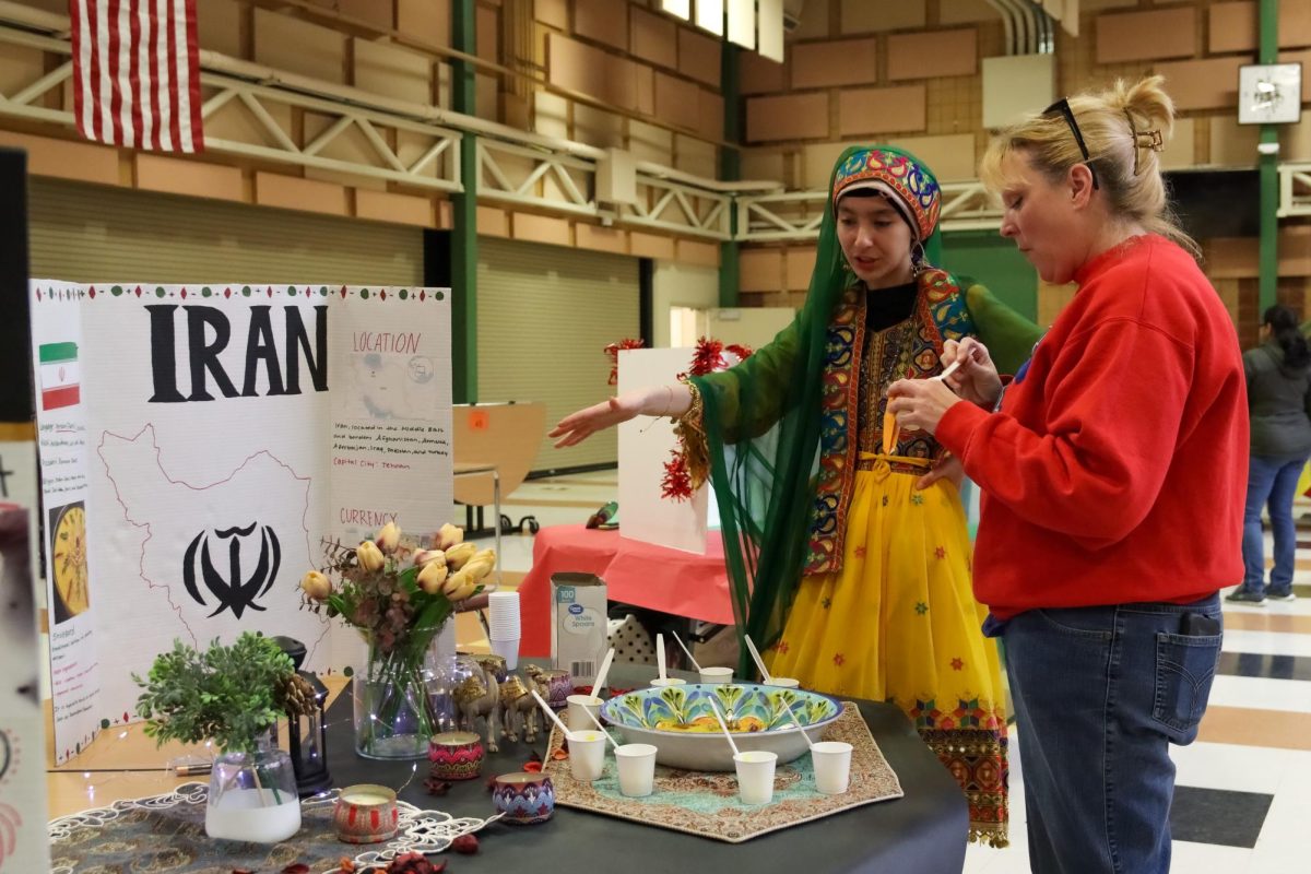 For International Day, sophomore Reihana Rahimi runs the Iran station. Similarly, other members decorated tables in the Commons. This was for last school years event, April 6, 2023. I basically informed people about our culture, I wore traditional clothing and I shared some traditions, Rahimi said.