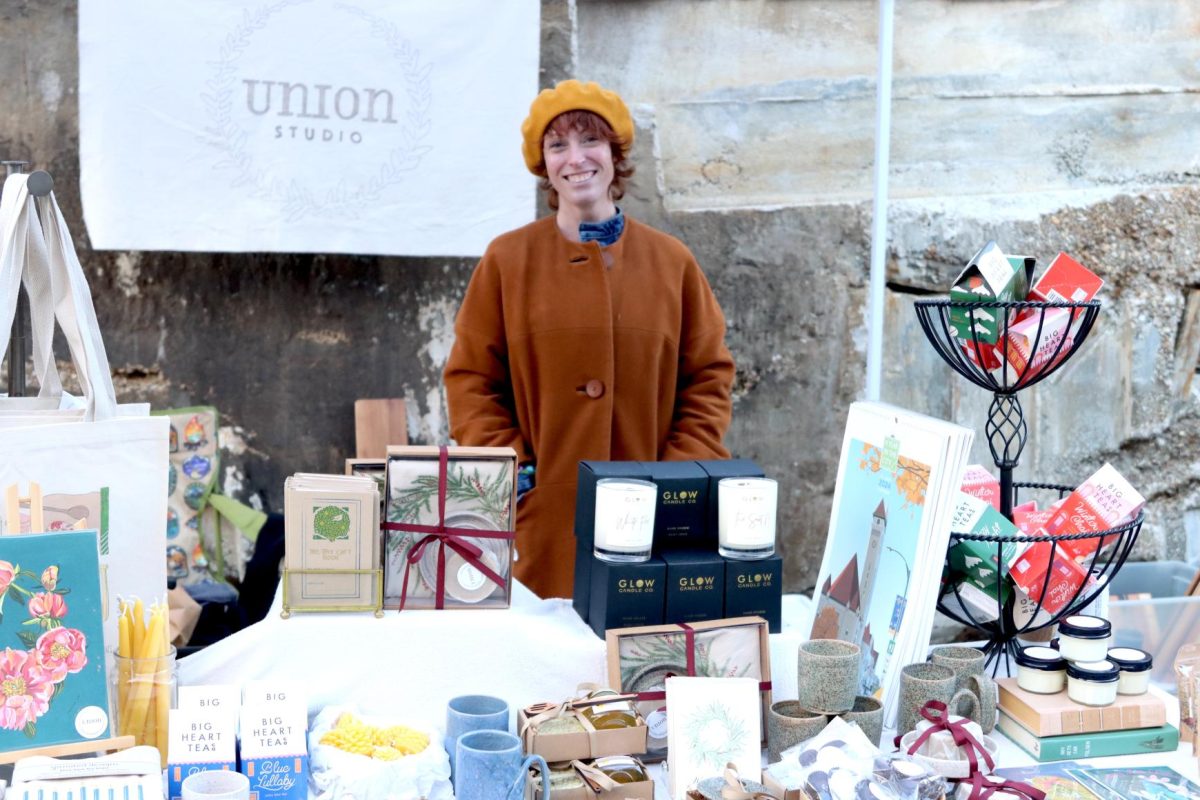 Jillian Flesh stands behind her booth of handmade products from a selection of St. Louis artists. Union Studio attends markets to recruit artists and sell their current artists work.