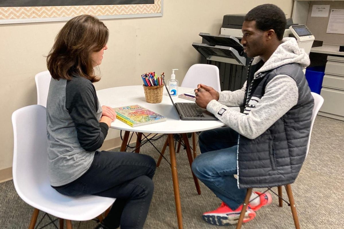In the Guidance Office, school  counselor Stephanie Mullins and junior CJ Woode review Woodes academic plan. Mullins said that after the first week of February, only counselors can alter students academic planners, but students are able to request changes.