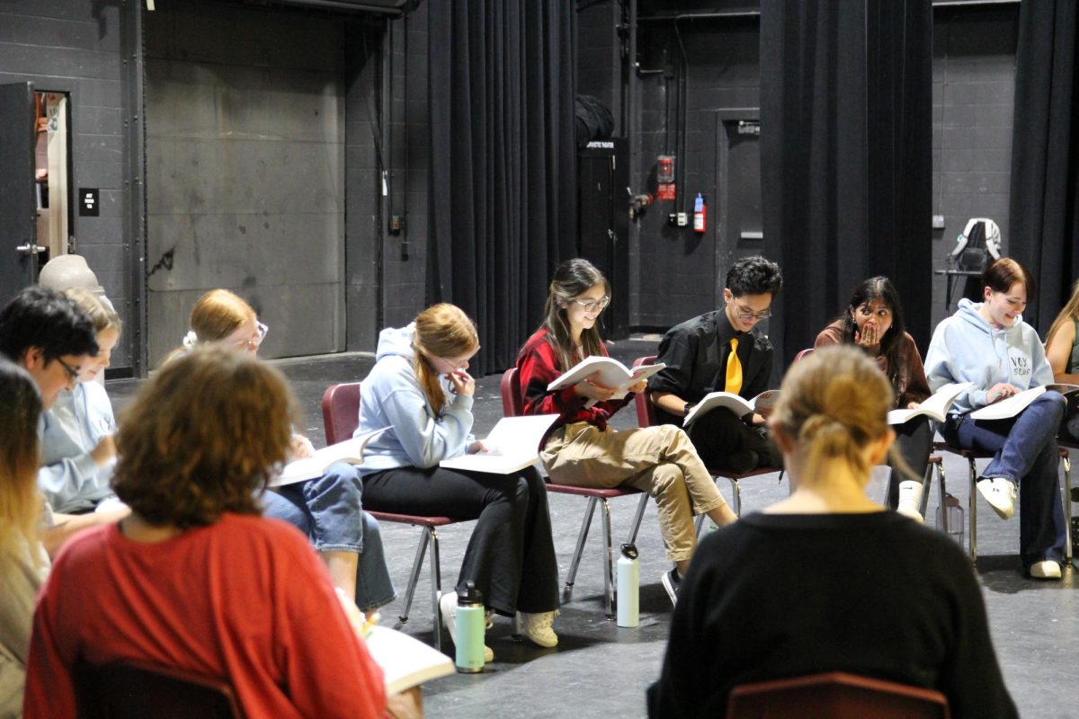 During the first read through of Freaky Friday, seniors (left to right) Lizzie Rattenborg, Keira Makalintal and Chris Songco sit together and look at their scripts for the first time. Theres a lot of Lafayette talent in this production, from the cast to the crew to our directing team, Makalintal said.