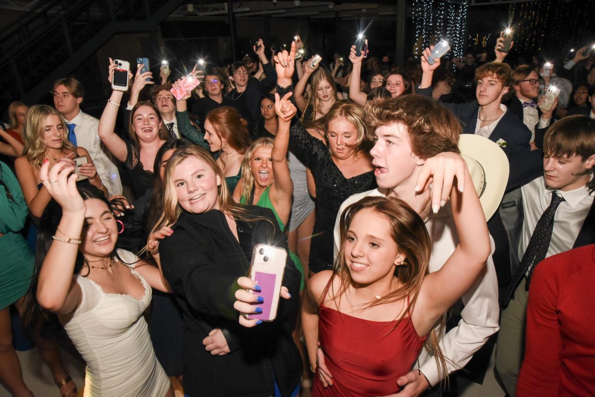 At the 2023 Winter Formal Dance, students dance in the Commons. Last years theme was Disco Fever. 