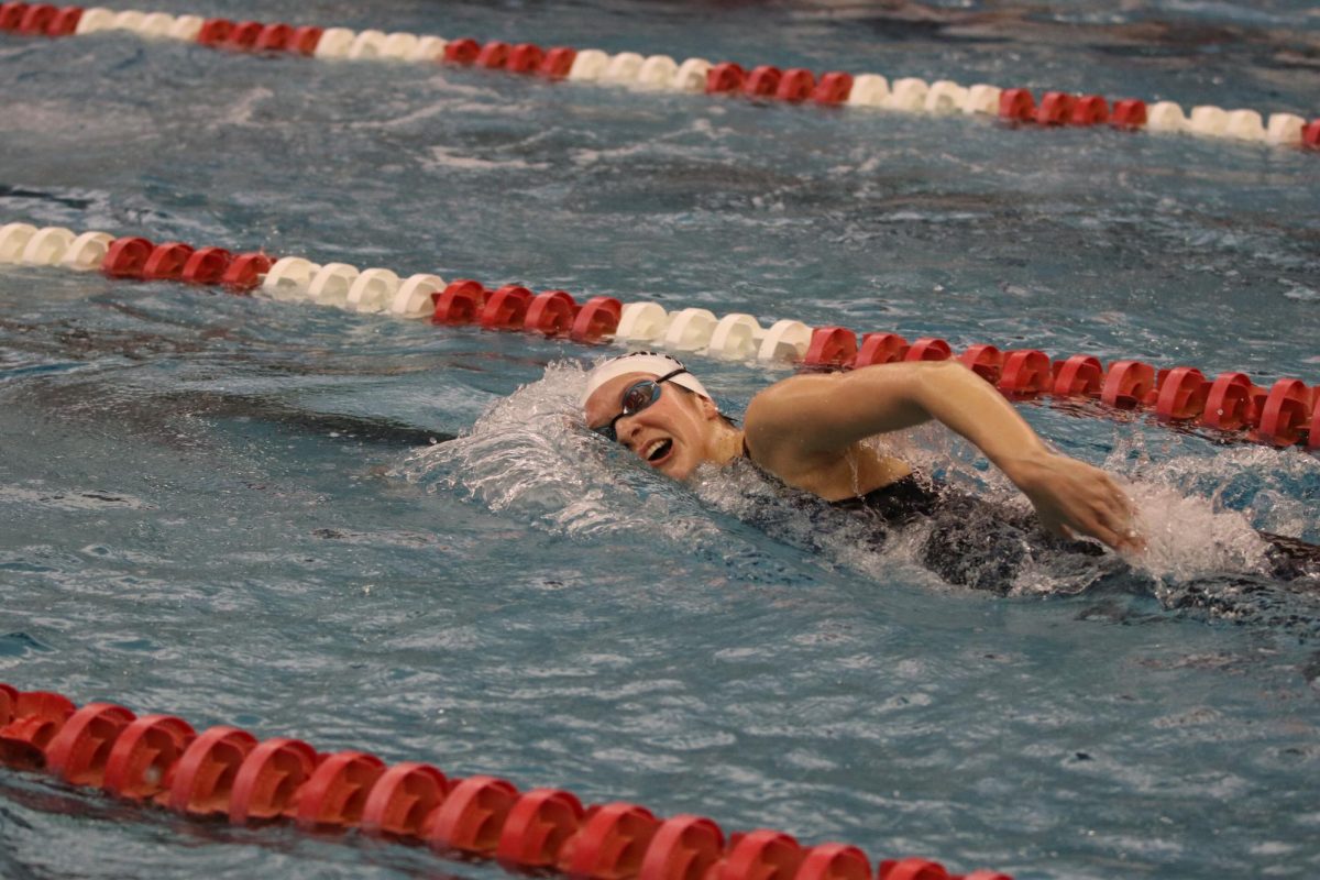 Gliding through the water, Ellie Kipper competes in freestyle at the Kirkwood Invitational. The Lady Lancers placed 4th at the meet. 