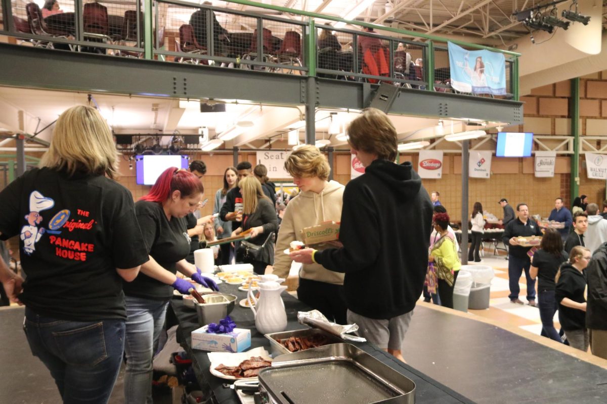 Students get samples from The Original Pancake House at the last Taste of West County, which that took place February of 2020. This year, the Taste of West County will be held March 11.