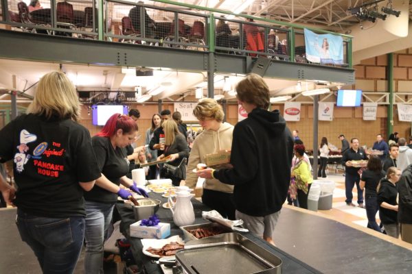 Students get samples from The Original Pancake House at the last Taste of West County, which that took place February of 2020. This year, the Taste of West County will be held March 11.