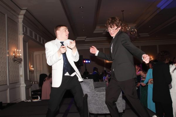 At the 2023 Prom, Class of 2023 graduates Joe Marlo and Will Barry stay at the edge of the main floor to do their dancing. Because the small dance floor was the most crowded area, many students gathered around the edges with friends or in small groups. 
