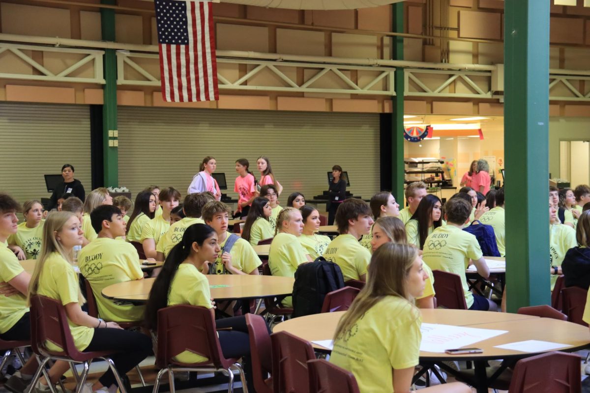  Lafayette students meet before athletes arrive in the commons to go over plans for the day. The buddy meeting was designed to help students paired with the athletes, learn about their partners.