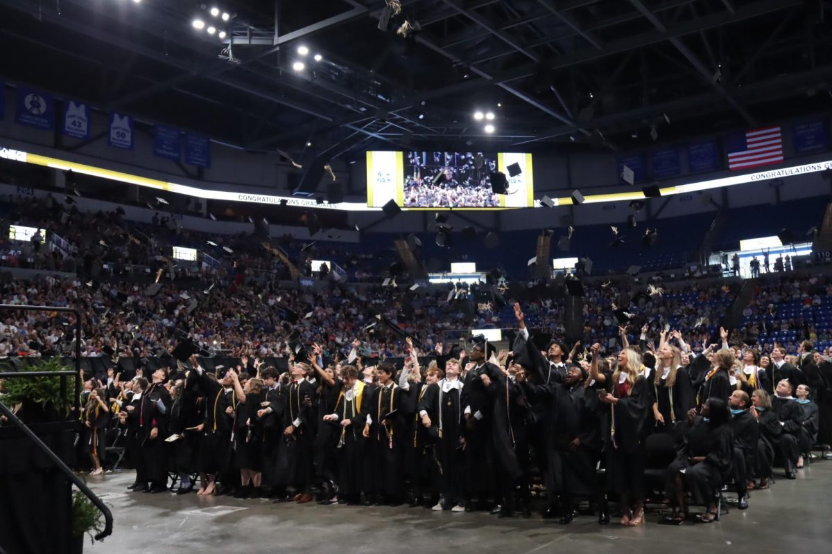 After graduating, the Class of 2023 throw their caps in the air. Last year's event occurred at Chaifetz Arena, while this year's graduation will be held at The Family Arena.