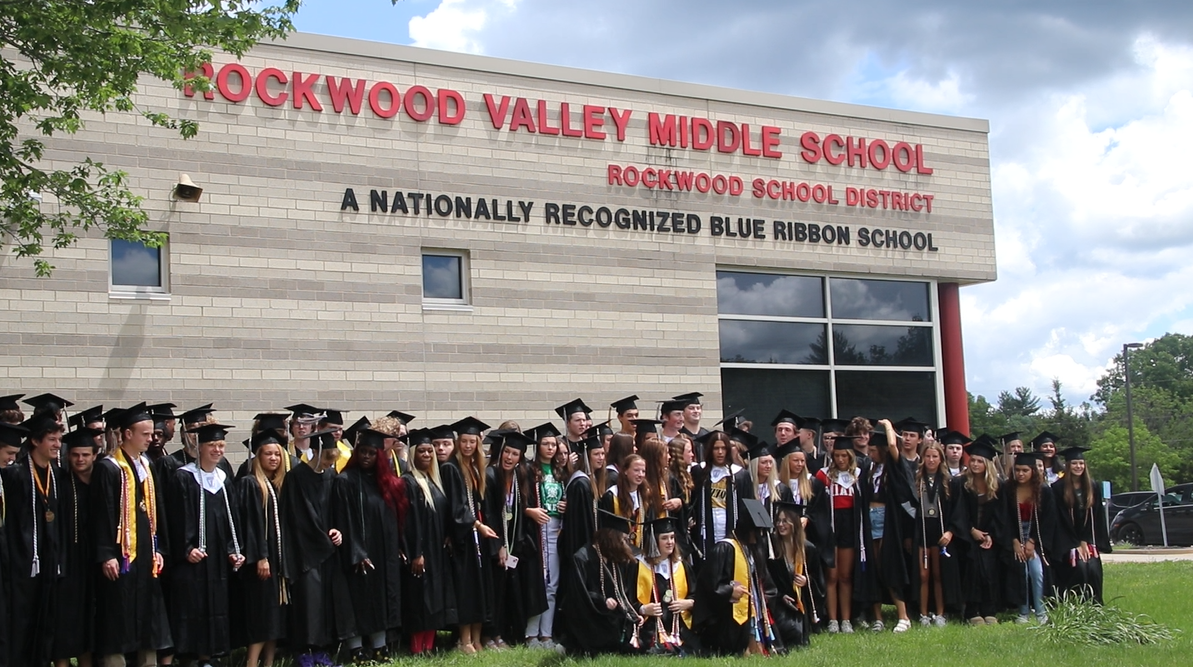 Graduating seniors who previously attended Rockwood Valley Middle School pose for a group picture in front of the school. 