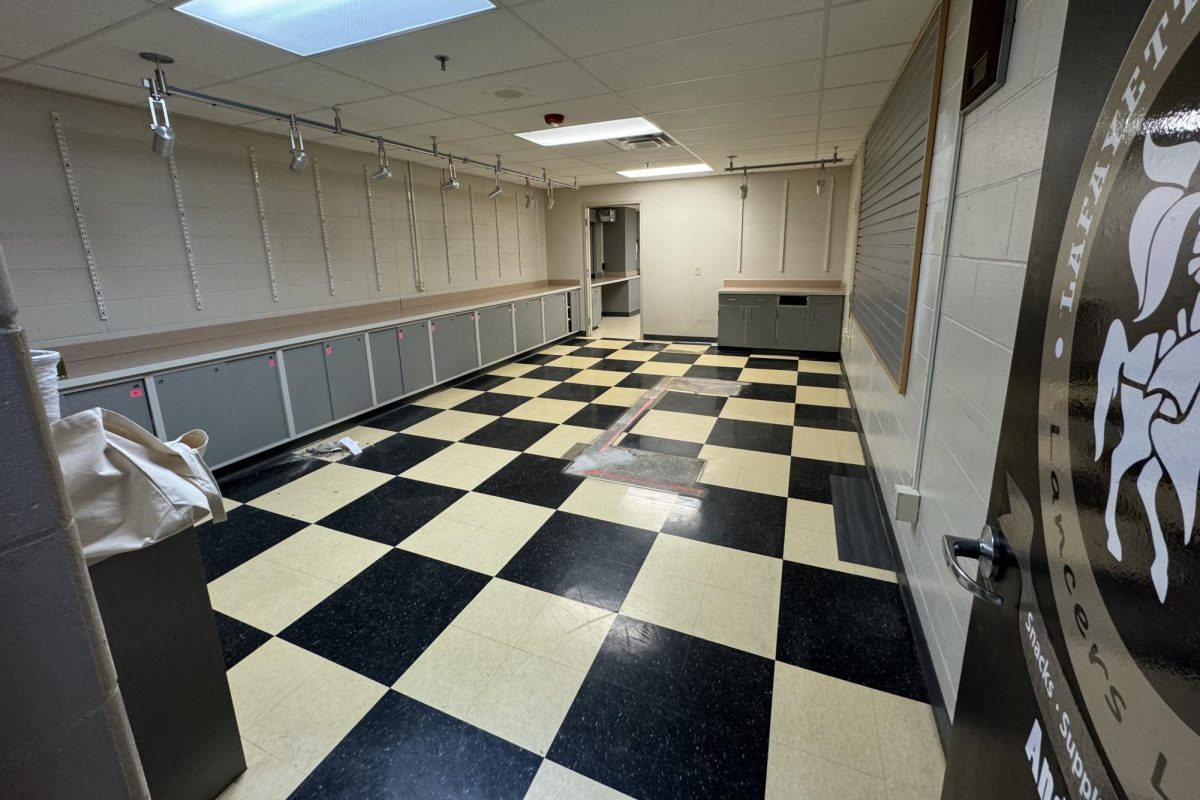 After removing the circulation desk and shelves, the store was prepped for paint and new flooring.