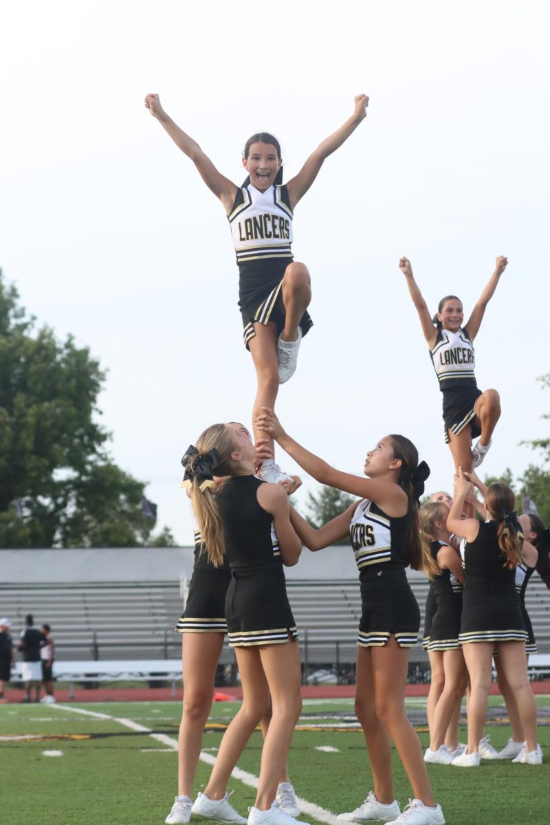 Following a performance from Jr Lancer Escadrille, junior Lancer cheerleaders take to the field to perform.