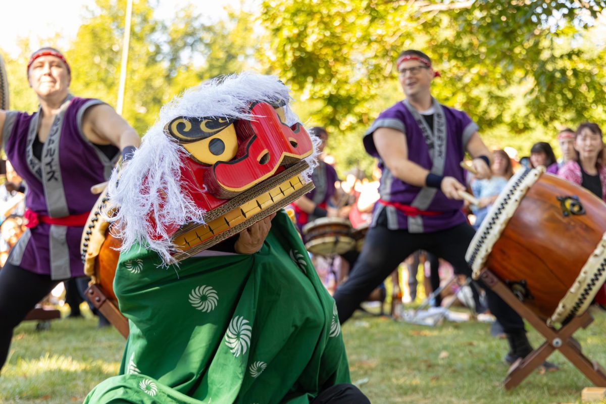 For the Japanese Festival Opening Ceremony, performers play Taiko drums.  The event is hosted in the Botanical Gardens due to having one of the largest Japanese gardens in the United States. "The garden [has] cherry blossoms, Japanese palm trees, a beautiful lake and a bonsai, very Japanese style. There’s a lot of Japanese related events because of that," Webster University instructor Hitomi Salini said. 

              Photo Courtesy Of Nathan Kwarta