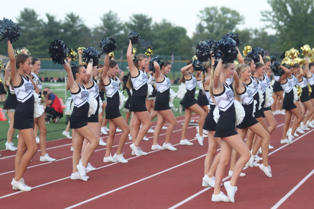 Between junior Lancer and high school team scrimmages, Lancer cheer teams perform. After each teams individual routine, all ages performed together.