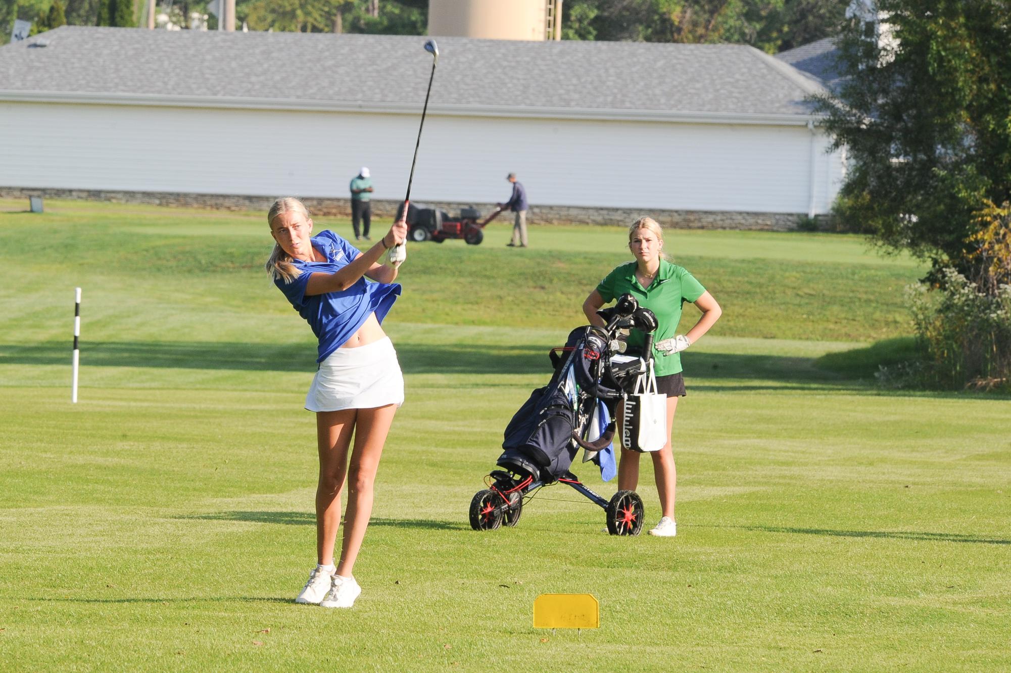 Senior Lila Dantuano swings at the Lindbergh Invitational, September 6, 2023. 