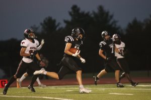 Sophomore Cody Keen runs into the endzone for his first touchdown of the night