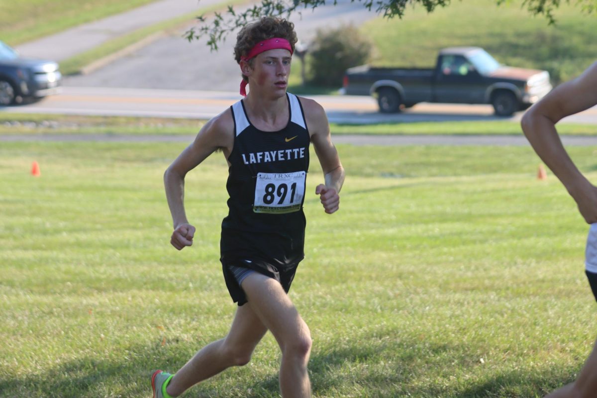 At the LivingWord Church cross-country meet, Class of 2024, Jack Robeson runs through the race course. Robeson was the team's fastest runner last season, coming 5th in the State meet. "We lost a few good runners, but we have many new guys looking to step up and compete," Head Coach Sean O'Connor said. 