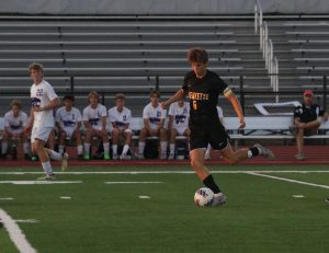 Senior center midfielder Sam Kalish passes the ball in a game against Eureka on Sept, 17, 2024.