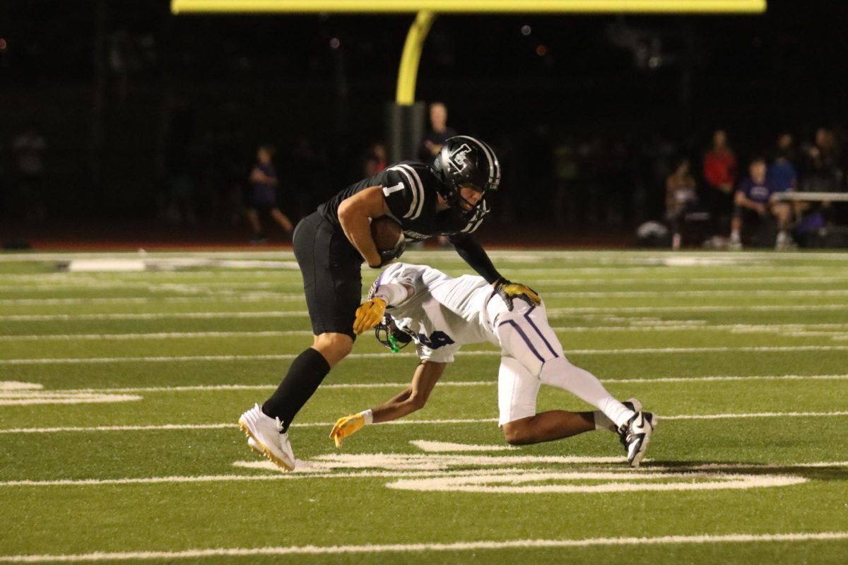 After catching a pass, senior Robby Preckel rushes down the field, before he is tackled by a Wildcats defender. Lafayette lost the Battle of 109 Oct.11, 30-15. 