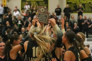 The Lancers hoist the District Championship trophy after their win against Eureka. The Battle of 109 resulted in a Lafayette win 3-1