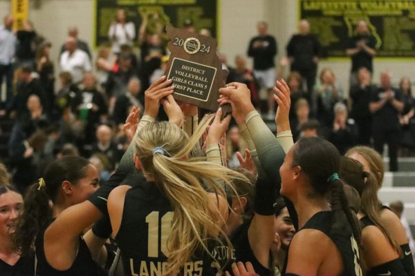 The Lancers hoist the District Championship trophy after their win against Eureka. The Battle of 109 resulted in a Lafayette win 3-1