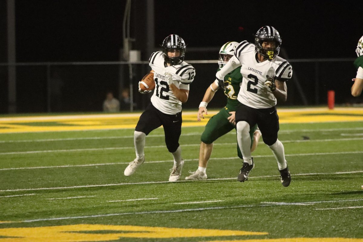 Sophomore running back Cody Keen rushes down the field against the Flyers. 