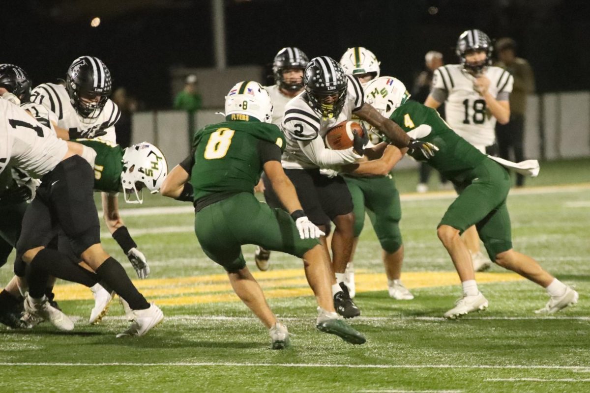 Running out of the backfield, senior running back Greg Robinson gains a few yards for the Lancers. Lafayette beat Lindbergh in a high scoring 42-28 game, Oct. 18. 