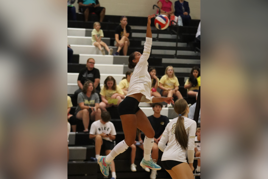 Playing outside hitter, senior Maya Witherspoon hits a kill against Oakville, Sept. 4, 2024. The Lancers would go on to win their first home game, 3-0. "Our goal as a team is win our third State Championship," Witherspoon said. 