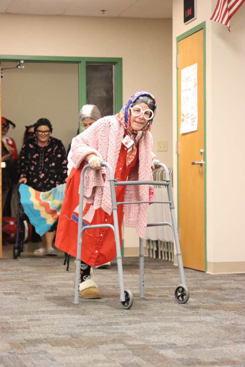 Strolling in with a walker, FACS teacher Rebecca Lawrence and her team dress as grandmas.