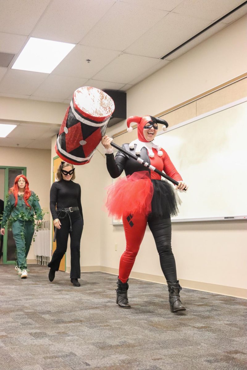 Hammer in hand, fine arts teacher Dana Lynch dresses as DC villain Harley Quinn.