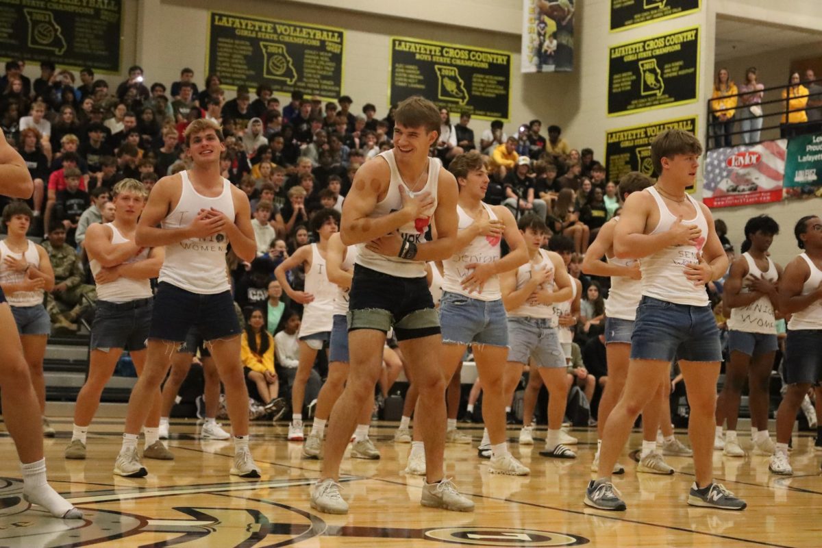 Grooving to Apple by Charlie XCX, Michael Callahan and CJ Campbell dance. Male Escadrille practiced four times before showcasing their new moves for their classmates at Powderpuff and the Pep Assembly.