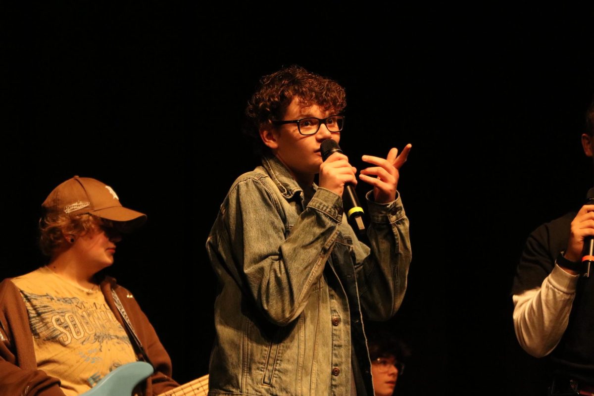 Performing "Birds of a Feather" by Billie Eilish with Wednesday Jam Band, sophomore Landon Jenne sings with the other members.