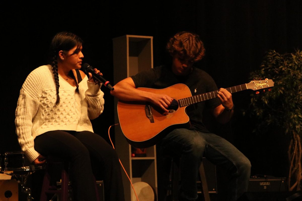 Following Monday Jam Band, seniors Annie Jones and Aidan McCoy perform a duet to "Rises the Moon" by Liana Flores.