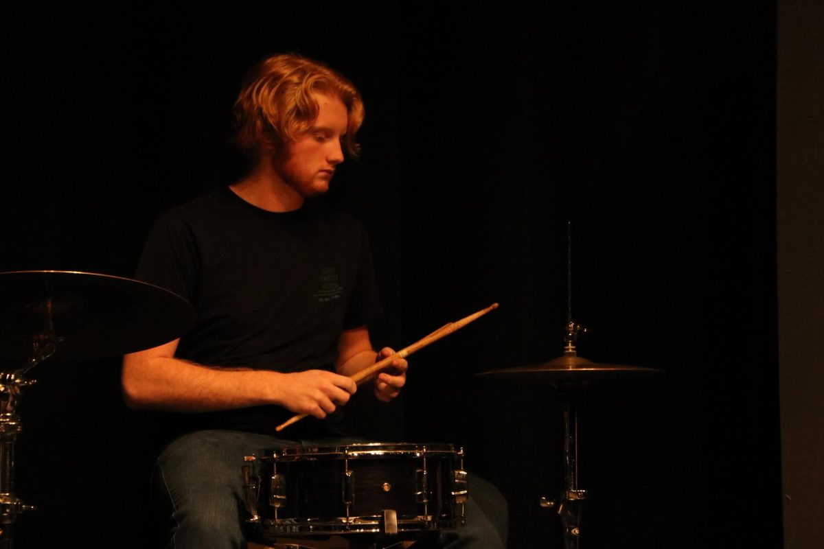 Nearing the end of the show, senior Greg Umstead gets ready to play "The Only Exception" by Paramore with Tuesday Night Rock Band.