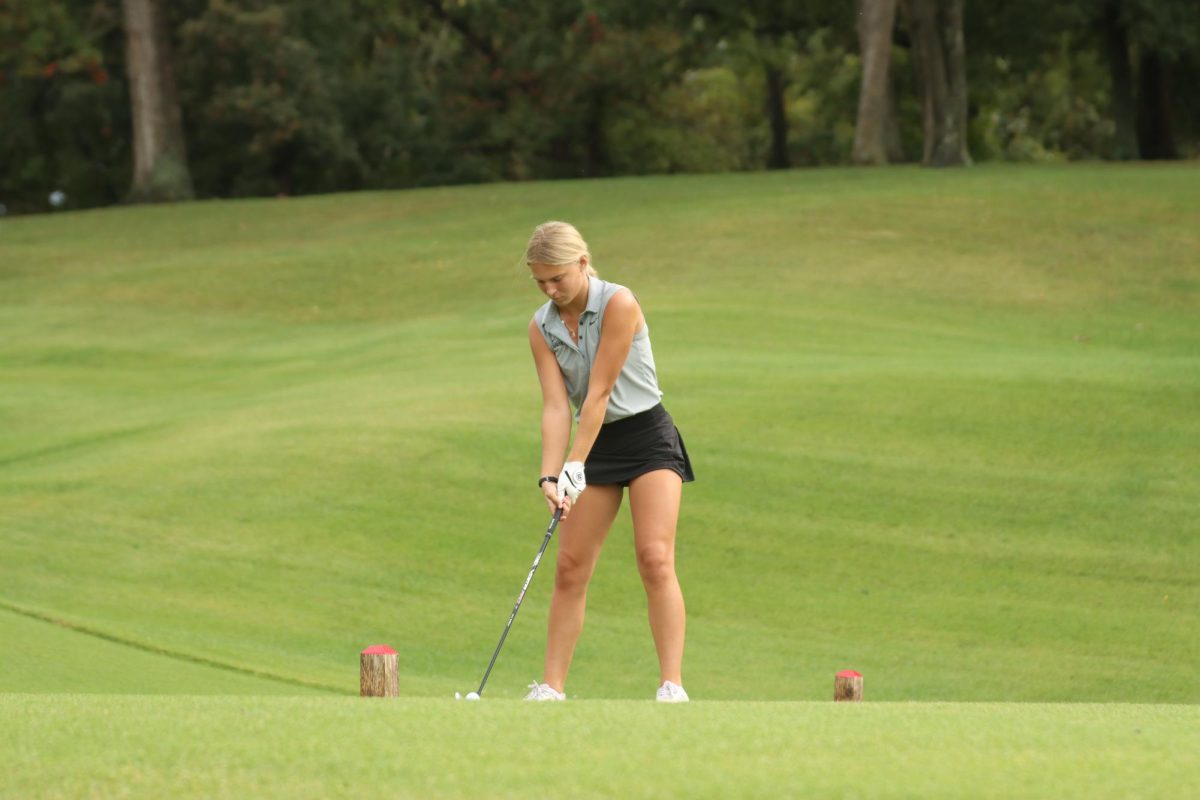 Senior girls golf player Addy Surber sets up to swing at Forest Hills Golf course, Sept. 24. 