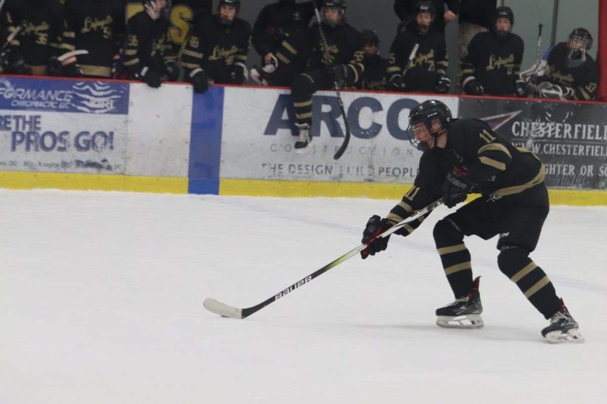 Senior forward Matt Ridgeway races down the ice towards the Eureka goal. Ridgeway scored 2 goals to help the Lancers win 5-3 on Nov. 16.