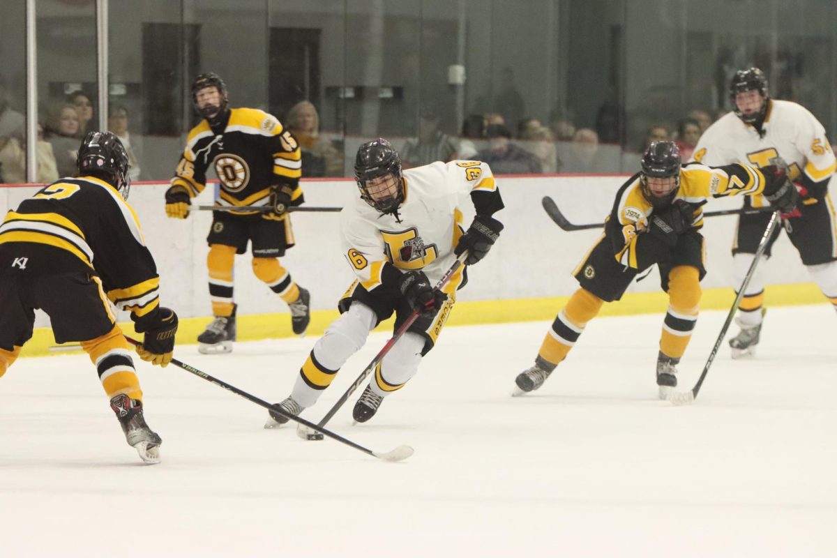 Sophomore forward Aaron Keller goes 1 on 1 with an Oakville defender. Keller scored one of the goals in Lafayette's 6-6 tie to the Tigers on Nov. 22.