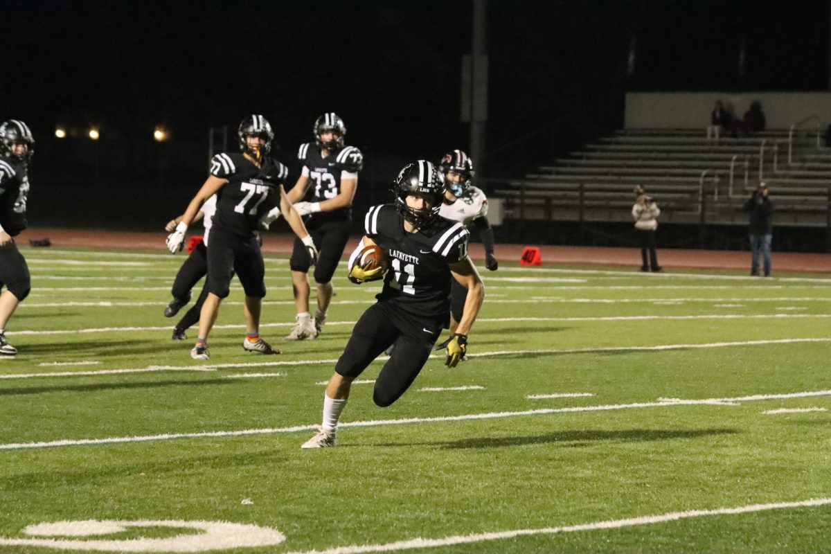 Senior reciever Jack Preckel looks for a hole as he runs toward the Colts. Lafayette recievers caught 18 passes for 227 yards and 2 touchdowns, Nov 1.