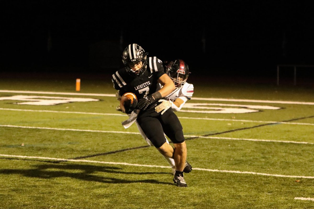 Senior receiver Brady Micek breaks a tackle. 