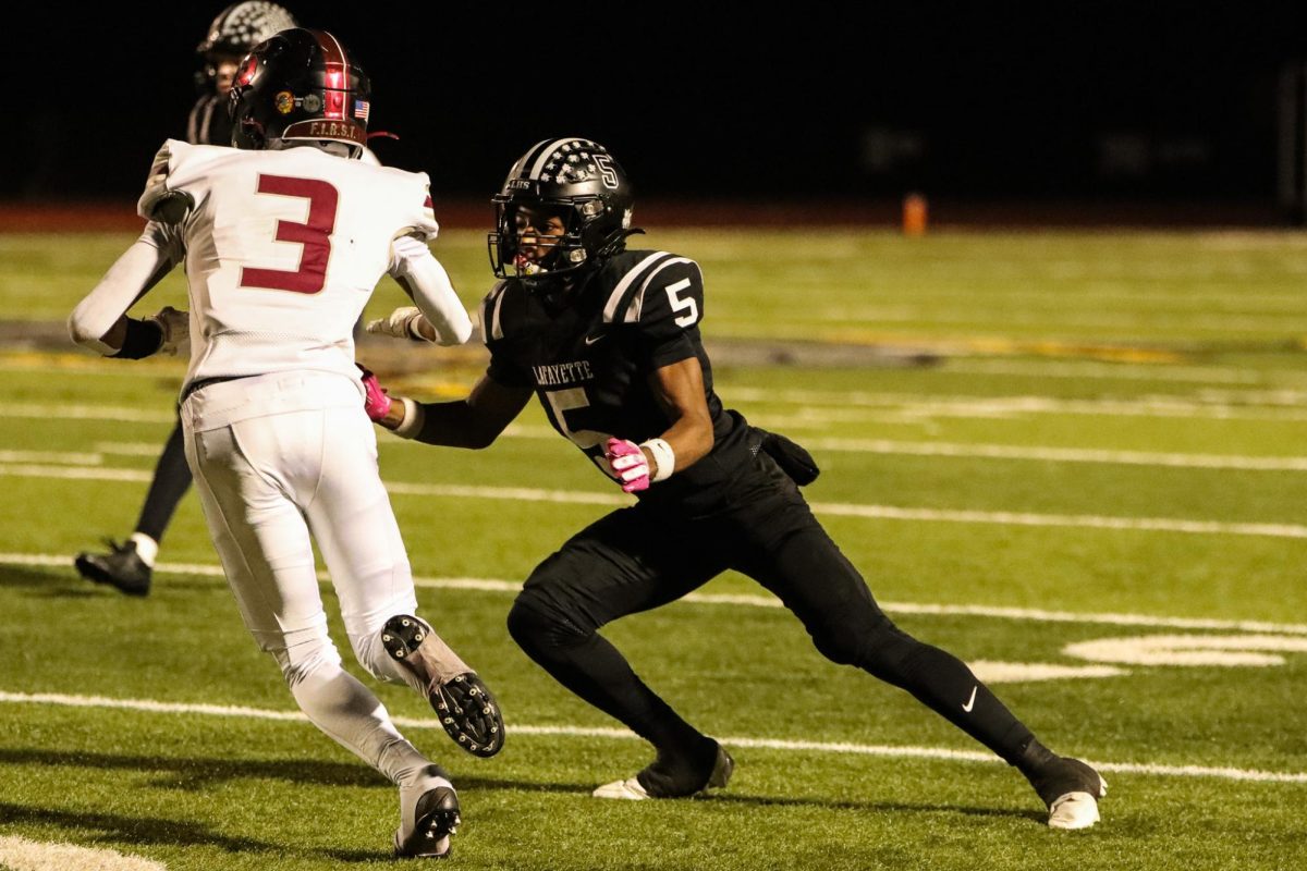 Senior defensive back Tim Washington covers Falcons receiver.