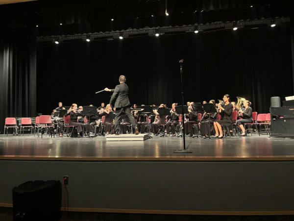 Wind ensemble, one of the three bands that performed on Oct. 30, plays their final song of the night. Music teacher Brad Balog conducted them.