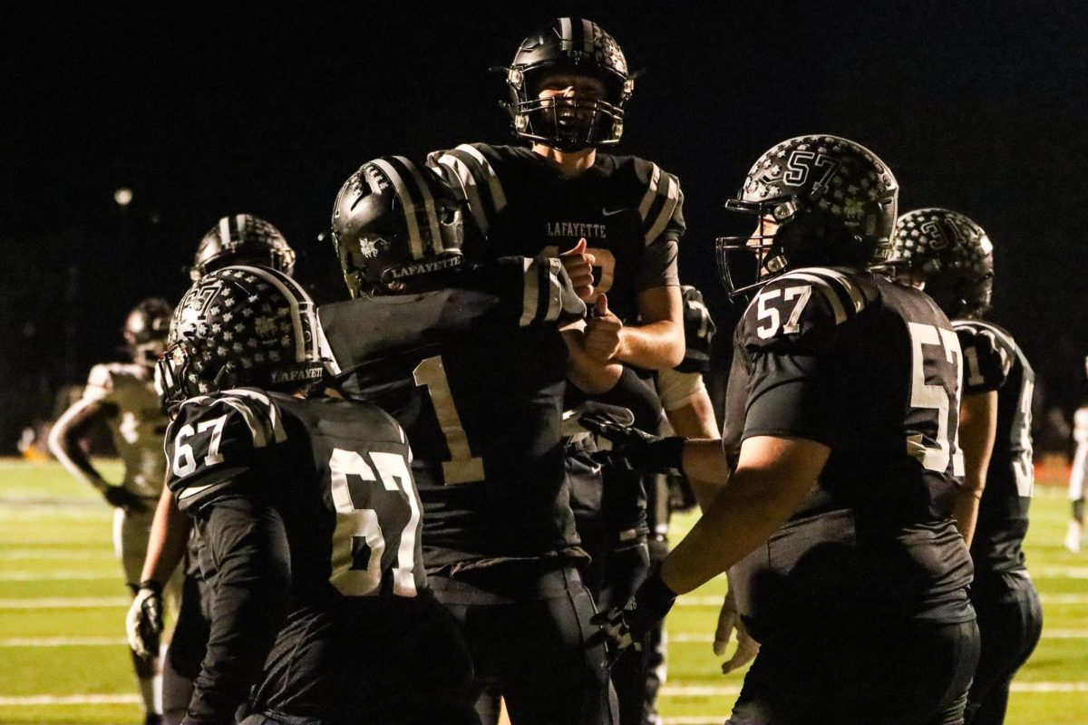 Lafayette offense celebrates after a touchdown.