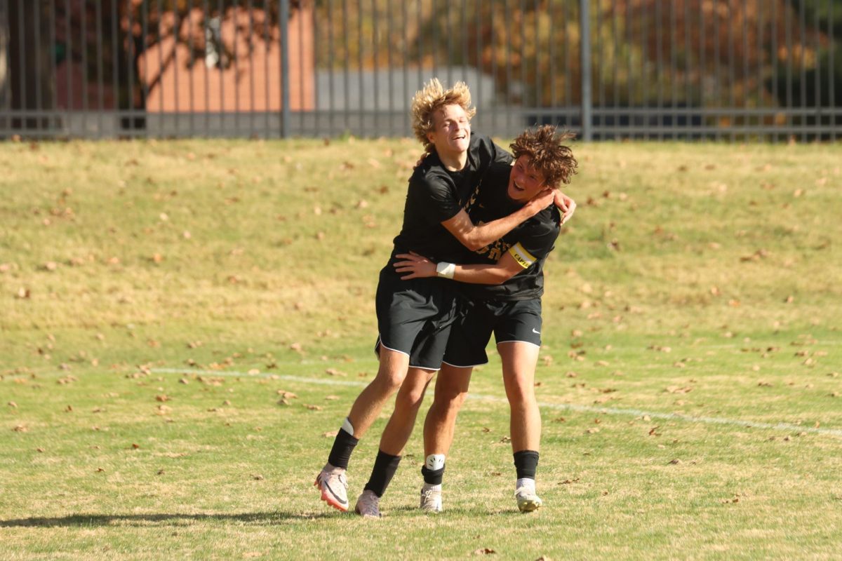 Senior Landen Peroutka celebrates with senior James Kolb after Peroutka scored a goal. Peroutka scored two goals against Parkway South to help Lafayette win 3-0.