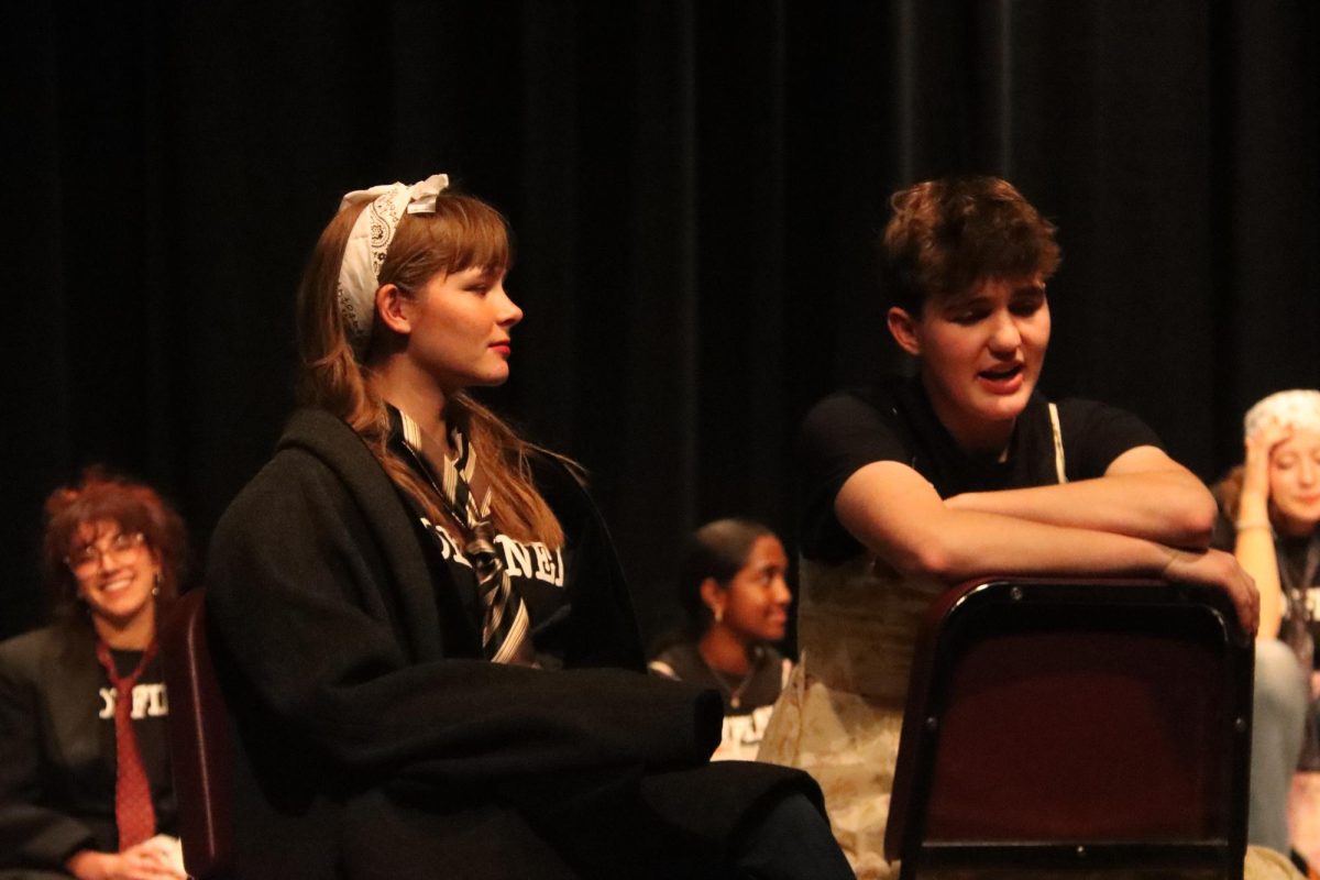 After "Four Corners," seniors Natalie Caudle and Evan Sommer take the stage to play "A Word From Our Sponsors." They decided to make their talk show about socks.