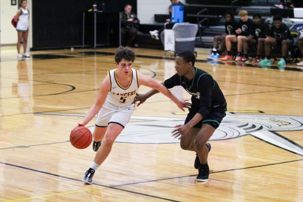 Junior Brady Micek dribbles past Pattonville defender. Head coach Don Kreienkamp mentioned Micek as a player to watch this season.