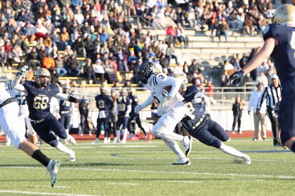 In the State semifinal, junior wide receiver Terance Bills rushes down the field. Bills scored Lafayette's lone touchdown of the game.