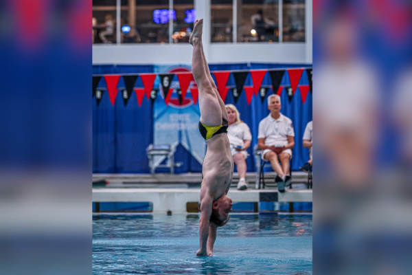 Senior diver Jackson Tenny kicks out straight in the MSHSAA Class 1 boys State championship. Tenny placed 2nd overall in the competition.