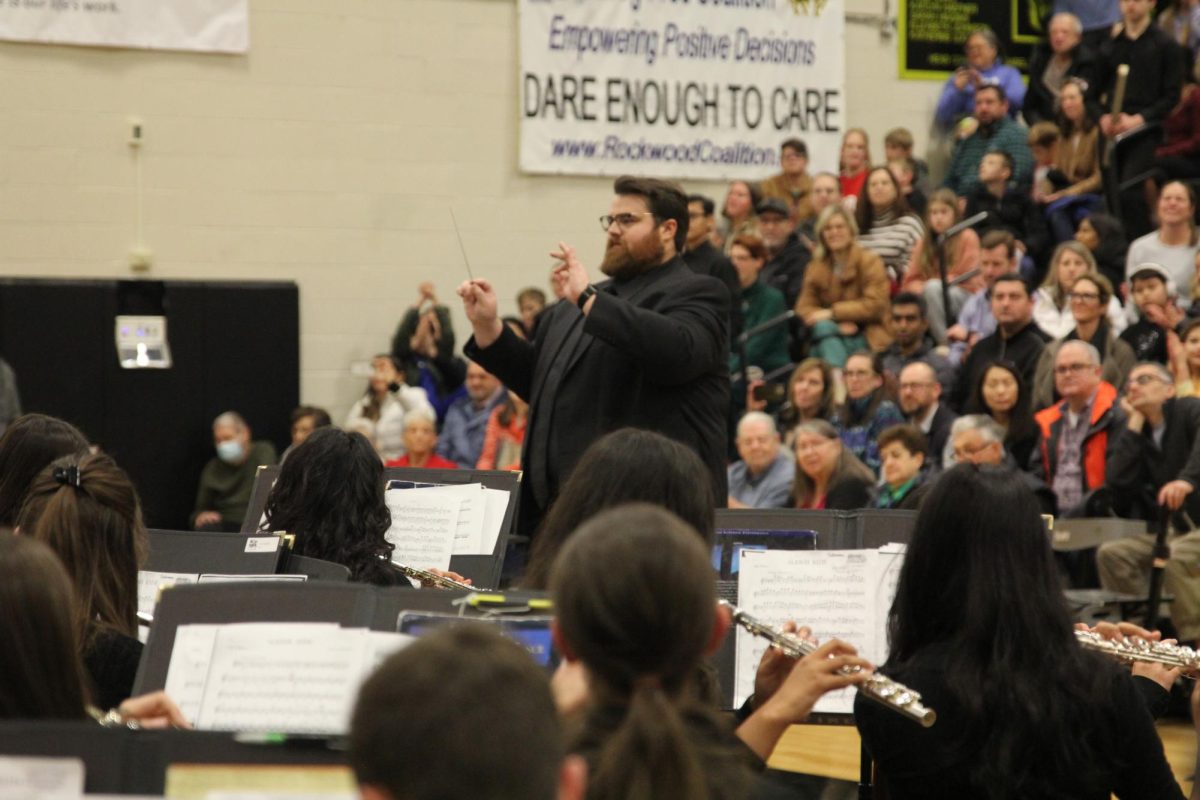 Music teacher Andrew Reader conducts "Sleigh Ride" as the flautists section plays on their cue.