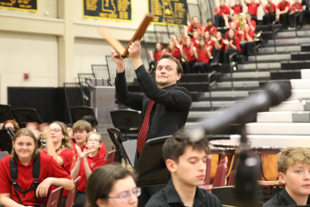 Music teacher Kevin Lowe directs the percussionists with slap-sticks in the stands, as well as the audience members who were encouraged to participate by clapping.